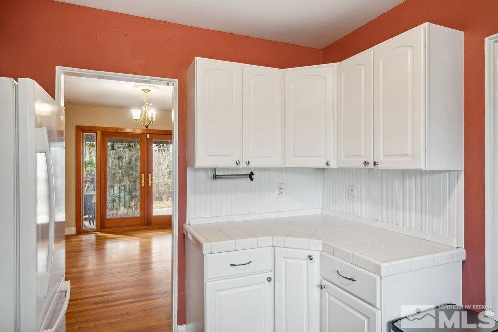 847 Washington Street Reno, NV 89503 - Photo 12 of 29 a kitchen with stainless steel appliances granite countertop a refrigerator and a cabinets