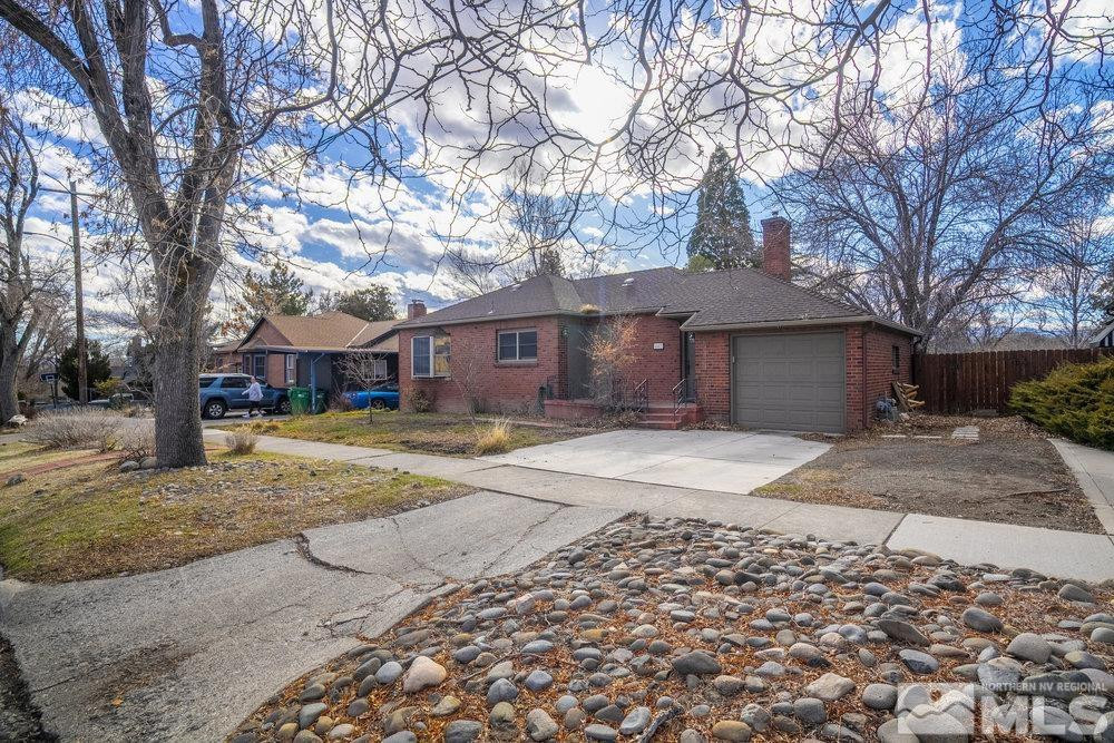 847 Washington Street Reno, NV 89503 - Photo 3 of 29 a front view of a house with a yard and garage
