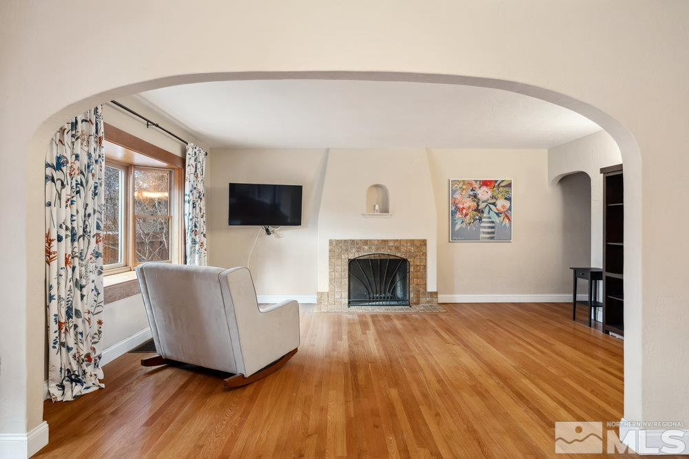 847 Washington Street Reno, NV 89503 - Photo 7 of 29 a living room with furniture a flat screen tv and a fireplace