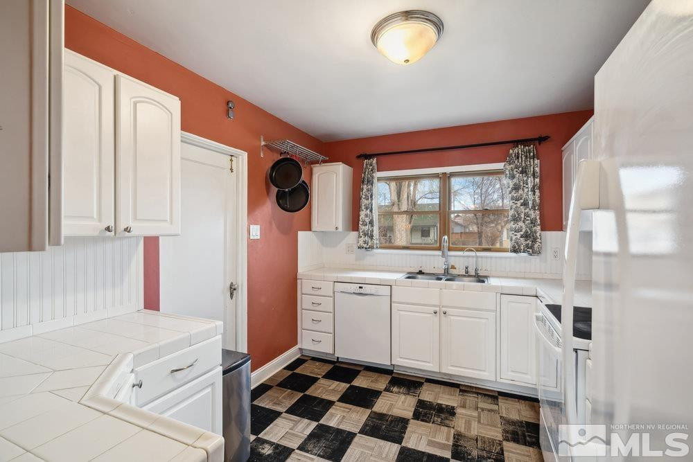 847 Washington Street Reno, NV 89503 - Photo 9 of 29 a kitchen with a sink and a stove top oven