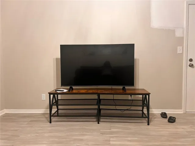 a living room with a flat screen tv