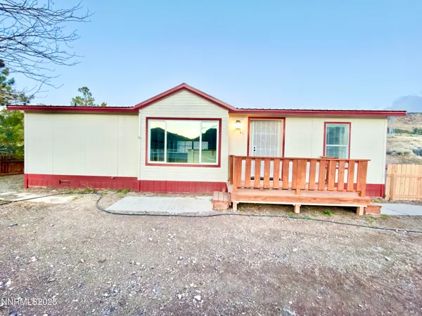 a view of a house with a yard and garage
