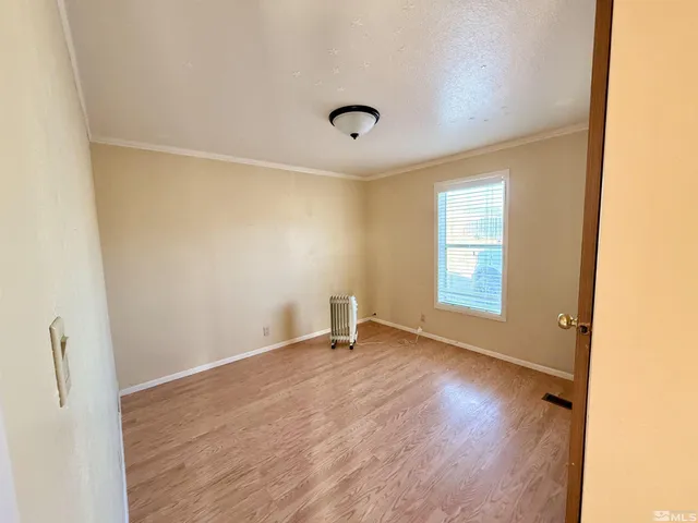 a view of a bathroom from a corridor