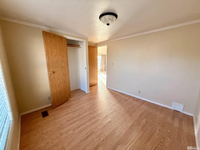 a view of living room with furniture and a window