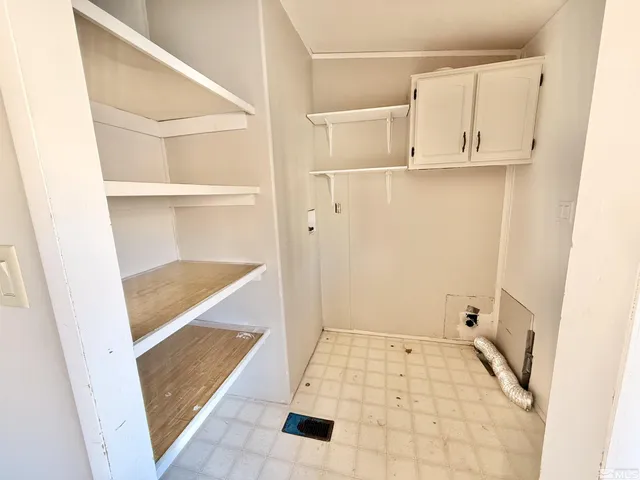 a view of a kitchen cabinets and a sink