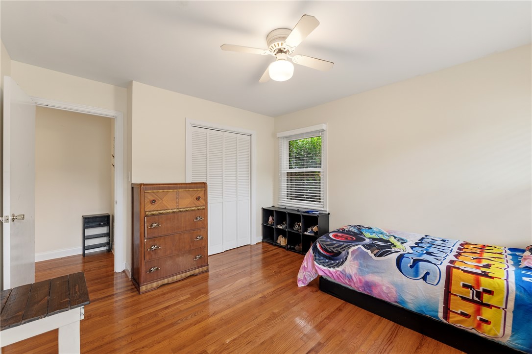 2807 Bellview Road Anderson, SC 29621 - Photo 21 of 31 Rich hardwood flooring complements the simple lines of this comfortable bedroom space.