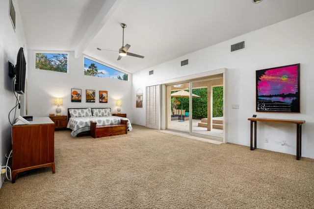 a view of a livingroom with furniture and a flat screen tv