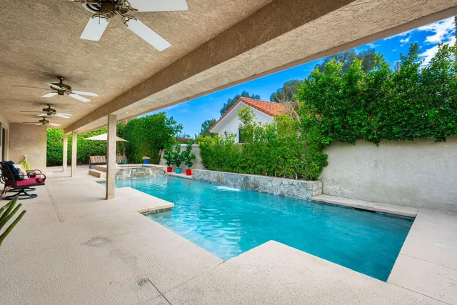 a view of a patio with a table and chairs