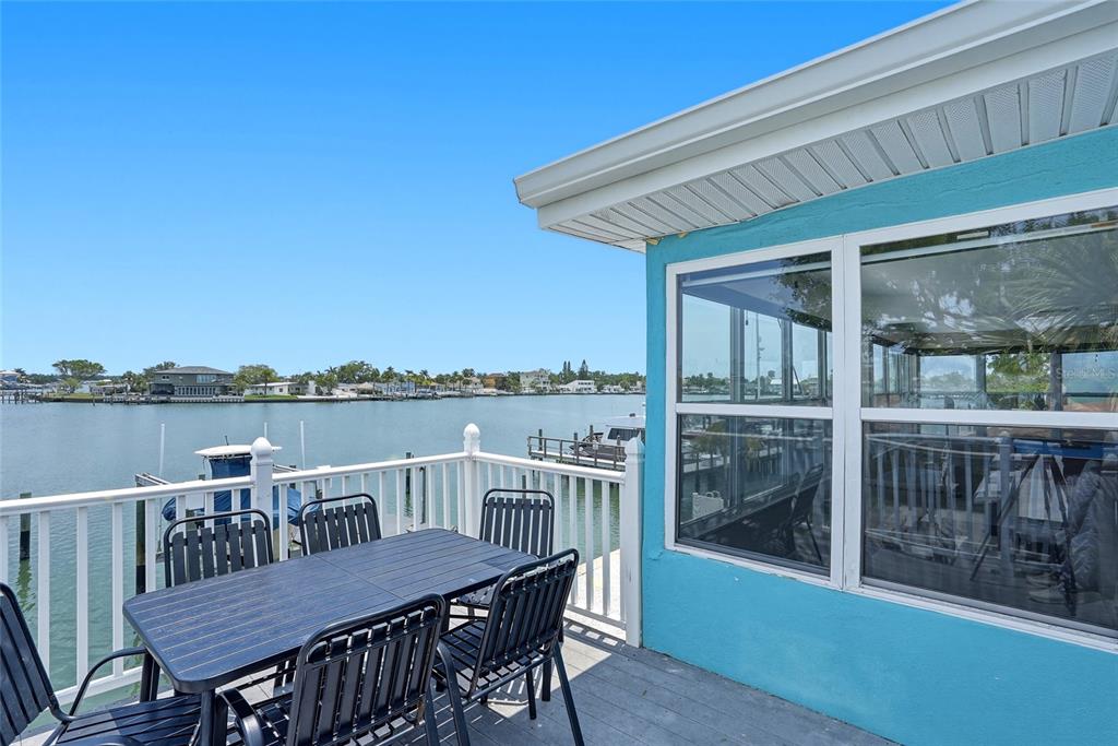 2311 Bay Boulevard Indian Rocks Beach, FL 33785 - Photo 11 of 80 a view of a roof deck with chair and wooden floor