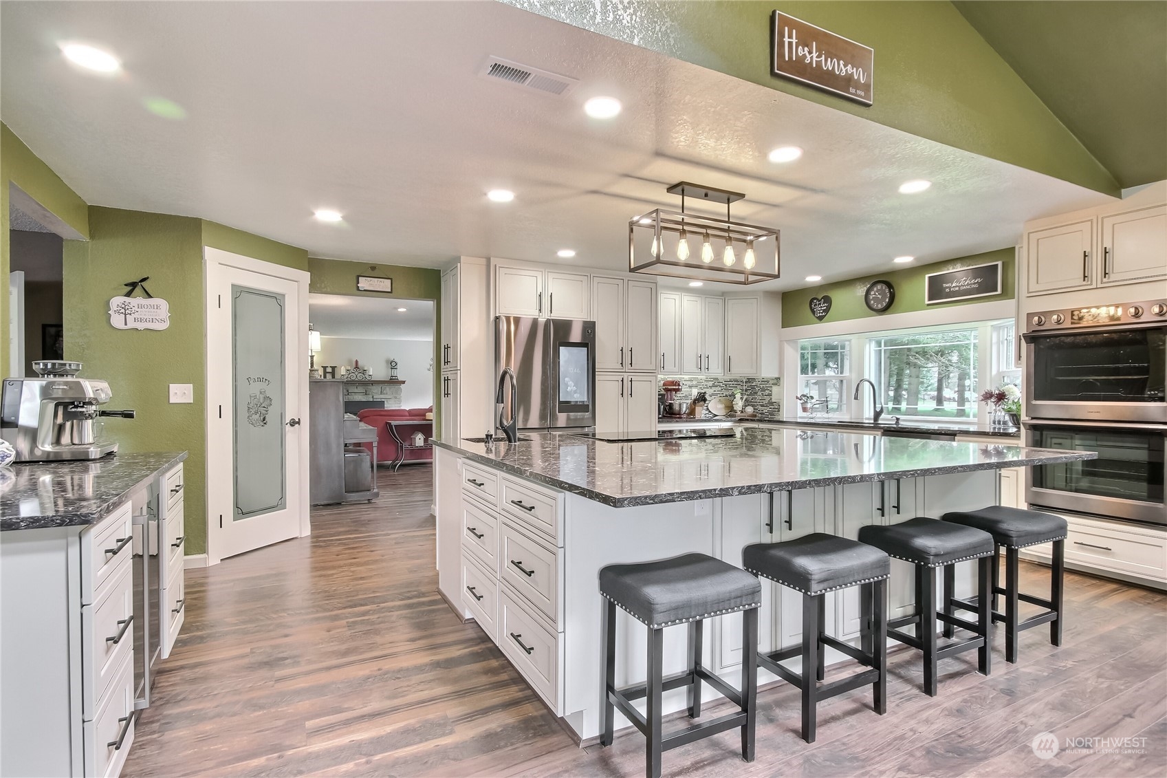 18623 Joselyn Road Southwest Rochester, WA 98579 - Photo 13 of 40 a kitchen with counter space and chairs in it