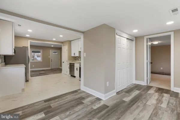 a view of a big room with closet and windows