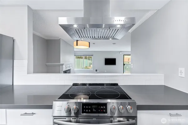 a kitchen with a stove and a cabinet