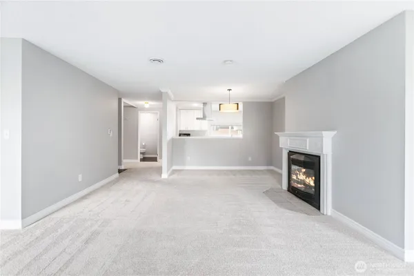 a view of a room that has a fireplace in it