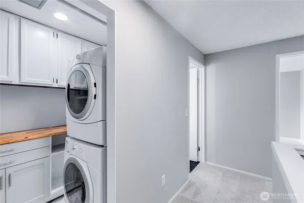 a view of a room with windows and closet