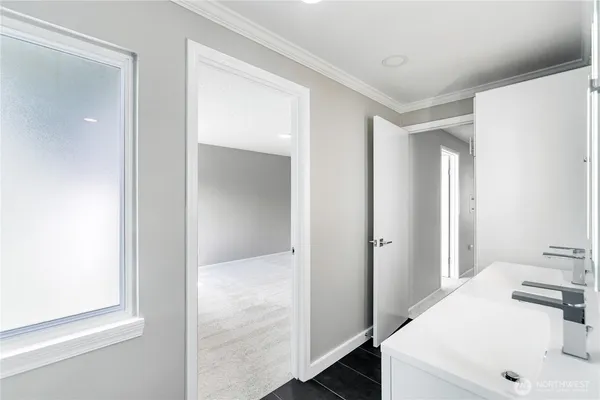 a bathroom with a sink and a mirror