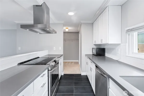 a kitchen with a sink and stove