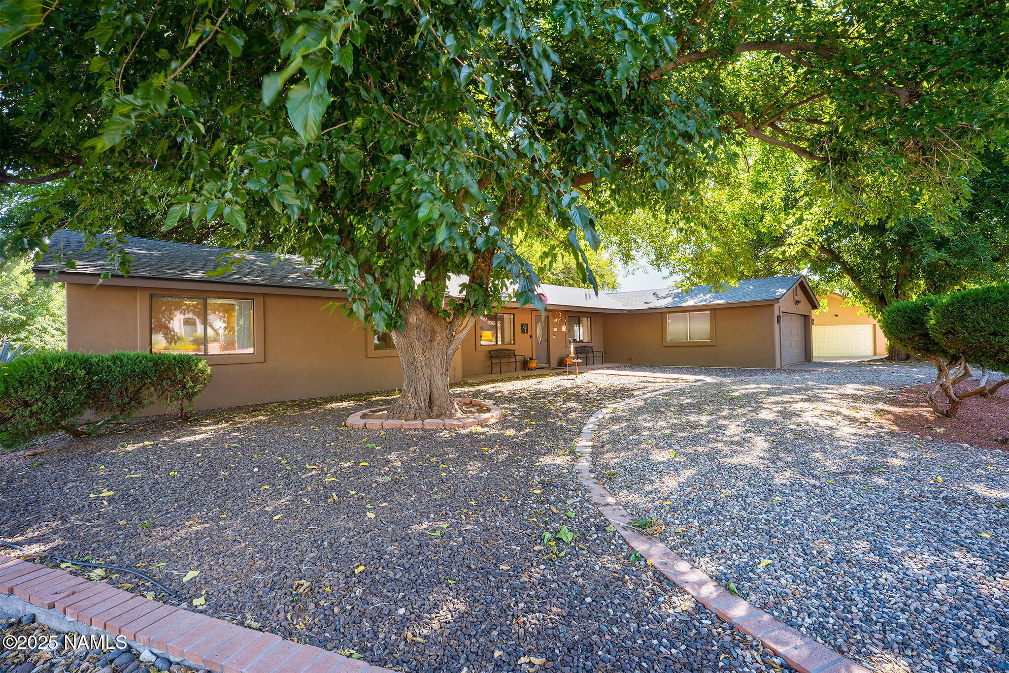 90 Vultee Road Sedona, AZ 86351 - Photo 18 of 25 a view of a house with a tree and a tree