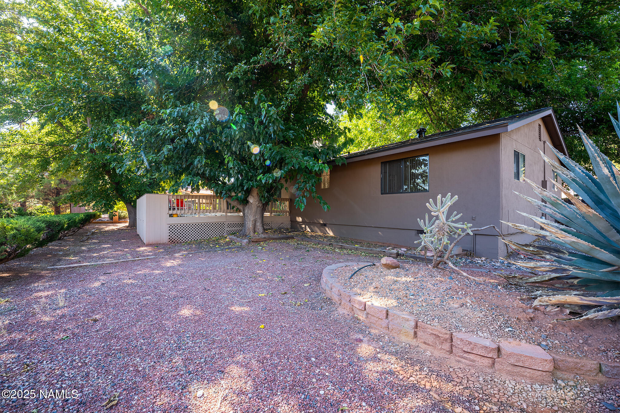 90 Vultee Road Sedona, AZ 86351 - Photo 22 of 25 a backyard of a house with oven and outdoor seating