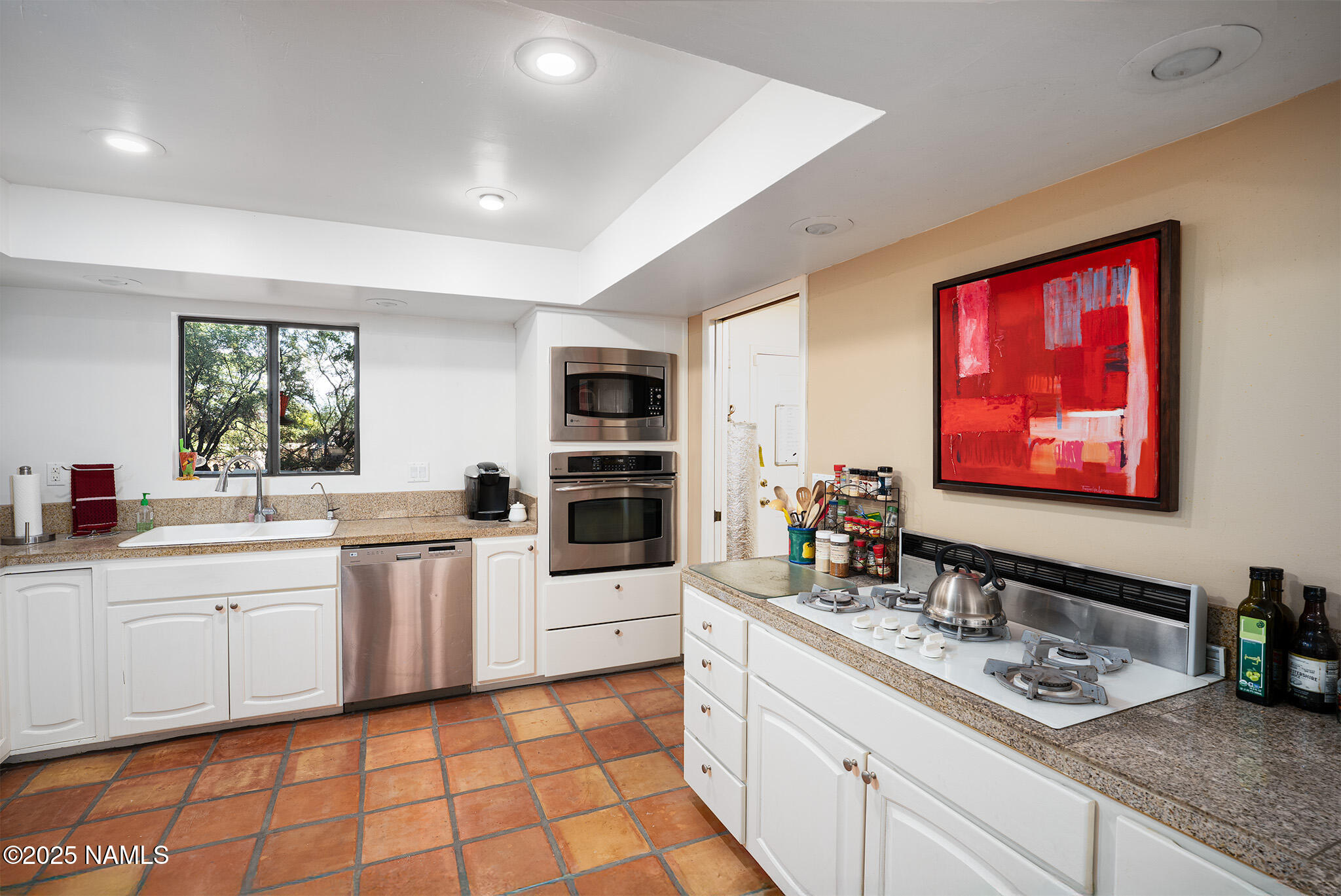 90 Vultee Road Sedona, AZ 86351 - Photo 4 of 25 a kitchen with stainless steel appliances a sink stove and cabinets