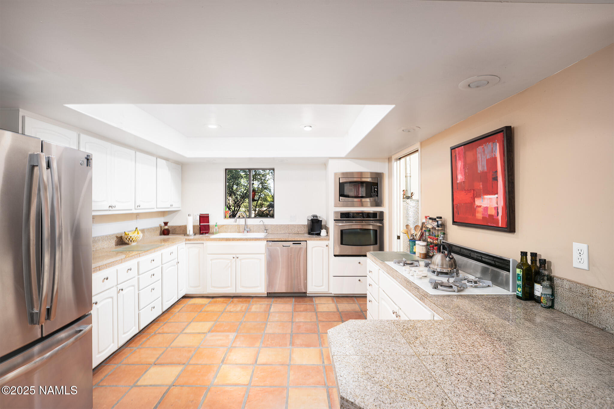 90 Vultee Road Sedona, AZ 86351 - Photo 6 of 25 a large white kitchen with stainless steel appliances kitchen island granite countertop a refrigerator and a sink