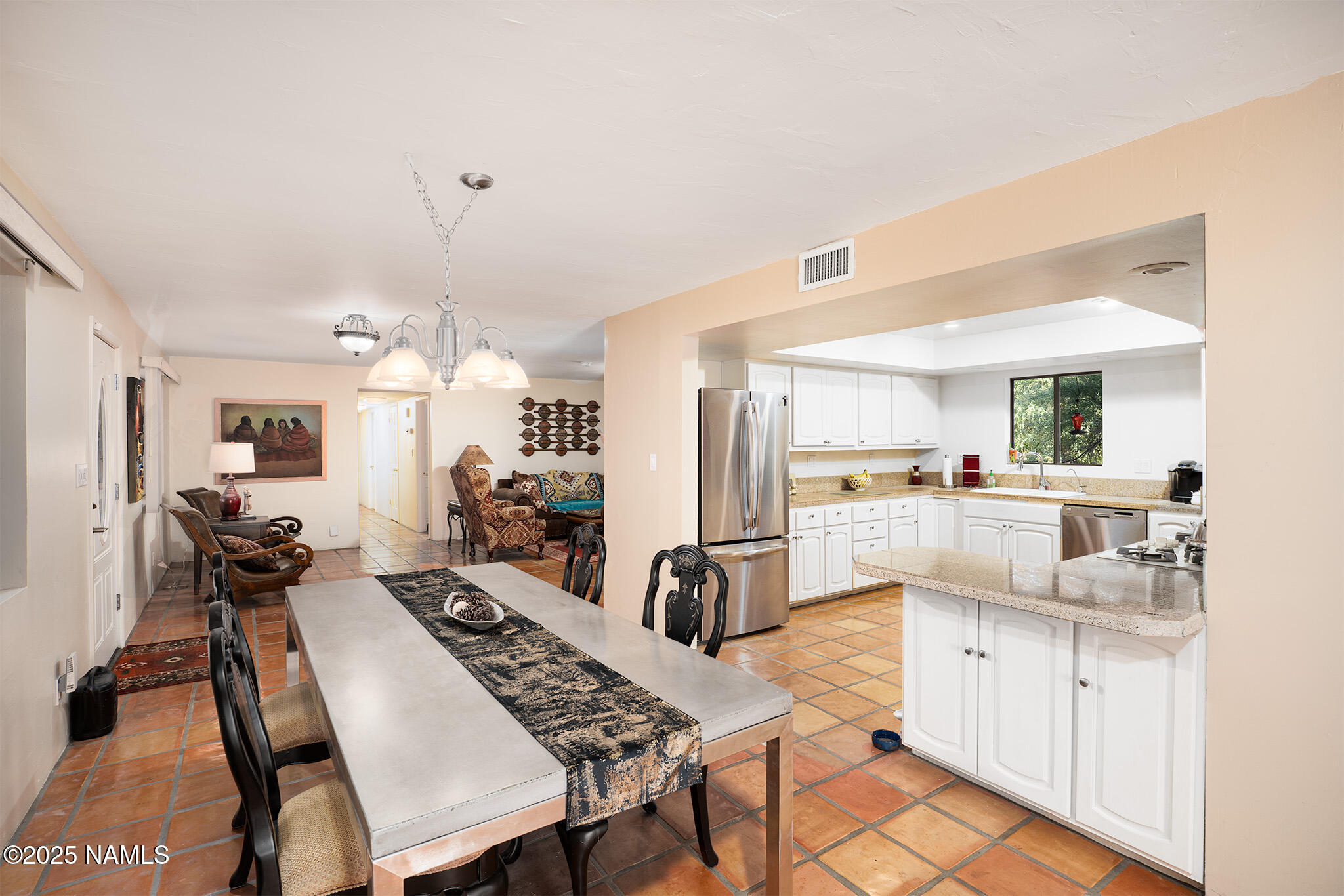 90 Vultee Road Sedona, AZ 86351 - Photo 8 of 25 a open kitchen with white cabinets and stainless steel appliances