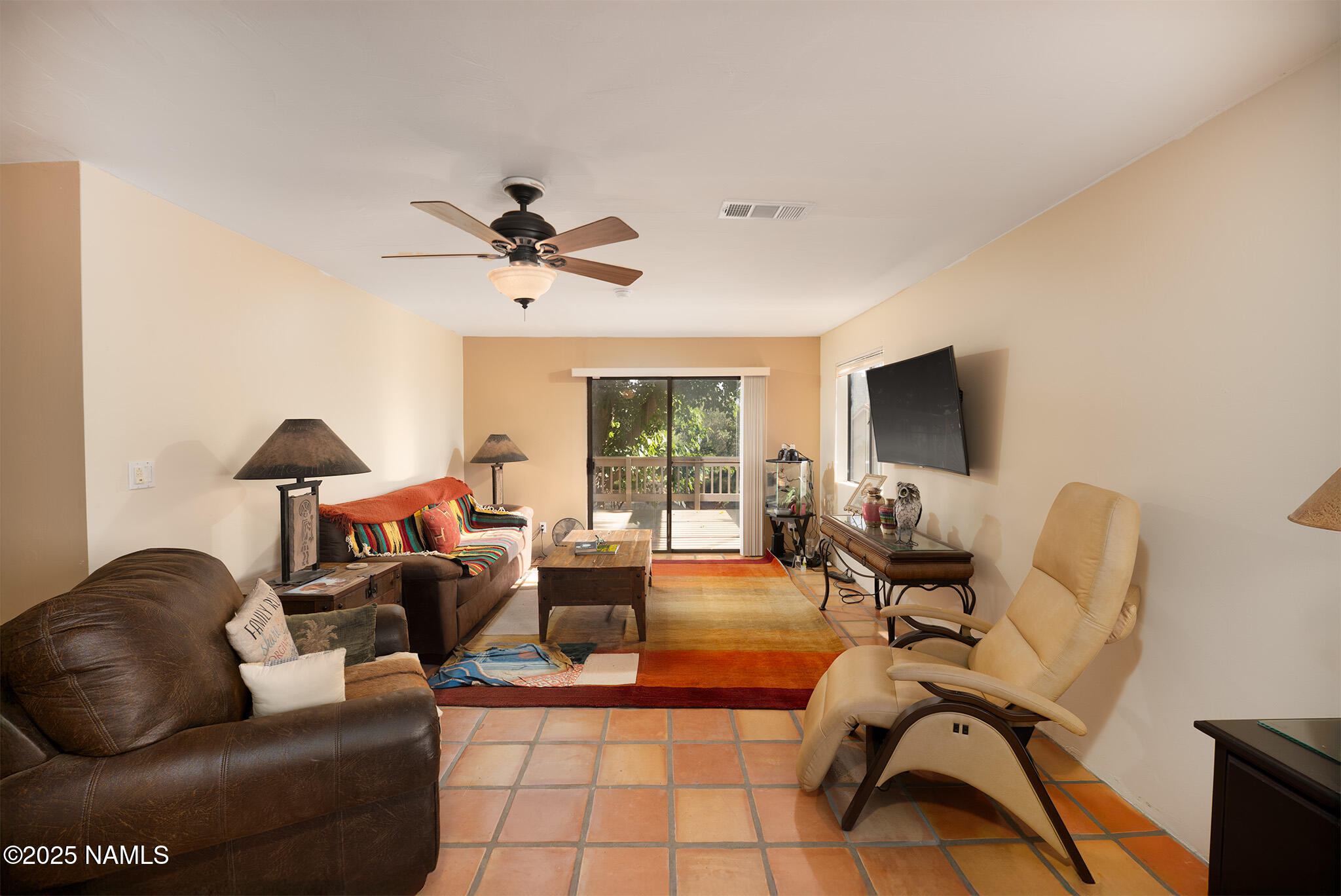 90 Vultee Road Sedona, AZ 86351 - Photo 10 of 25 a living room with furniture and a flat screen tv