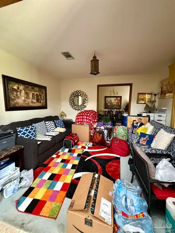 a bedroom with furniture and a baby crib