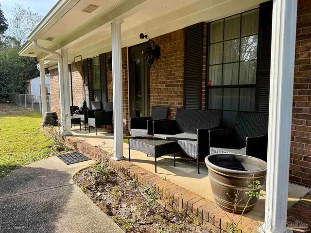 a picture of a bathroom with a shower curtain
