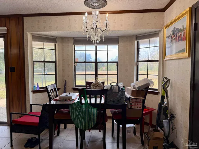 a view of a dining room with furniture window and outside view
