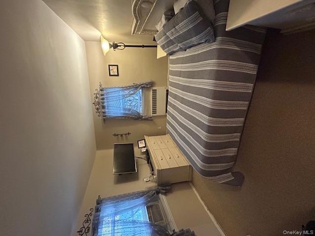 450 Pelham Road, Unit 1B New Rochelle, NY 10805 - Photo 3 of 10 a bedroom with a bed and wooden floor