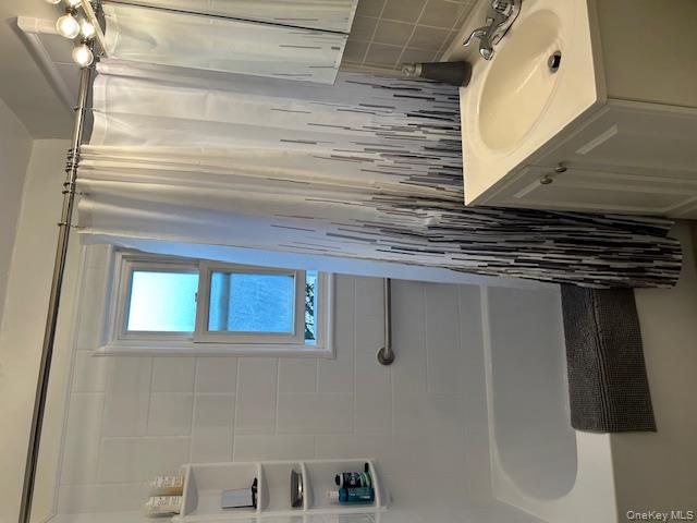 450 Pelham Road, Unit 1B New Rochelle, NY 10805 - Photo 6 of 10 a bathroom with a sink and a shower