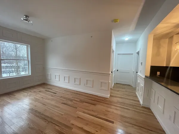 a view of a kitchen with a sink and a window