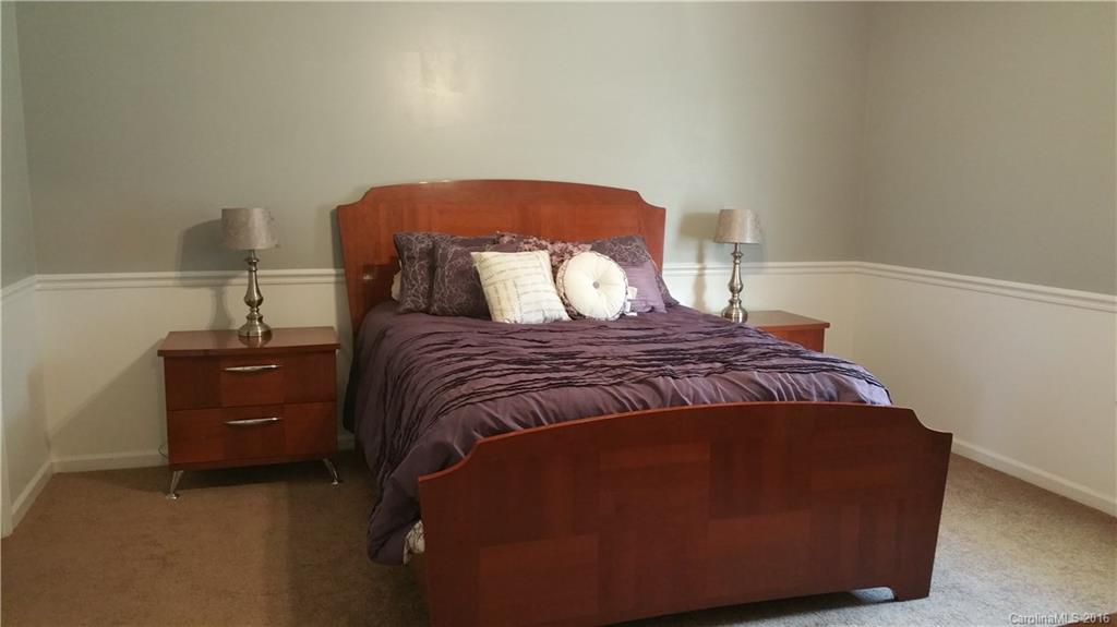 1348 Lawrence Road Clover, SC 29710 - Photo 11 of 21 a large bed sitting in a bedroom next to a window