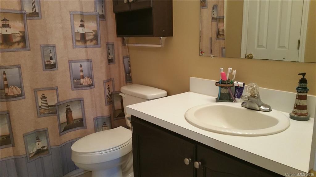 1348 Lawrence Road Clover, SC 29710 - Photo 13 of 21 a bathroom with a sink a toilet and shower