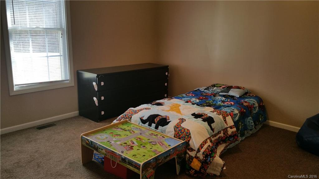 1348 Lawrence Road Clover, SC 29710 - Photo 14 of 21 a bedroom with a bed and a window
