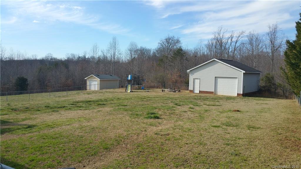 1348 Lawrence Road Clover, SC 29710 - Photo 18 of 21 a house with green field in front of it