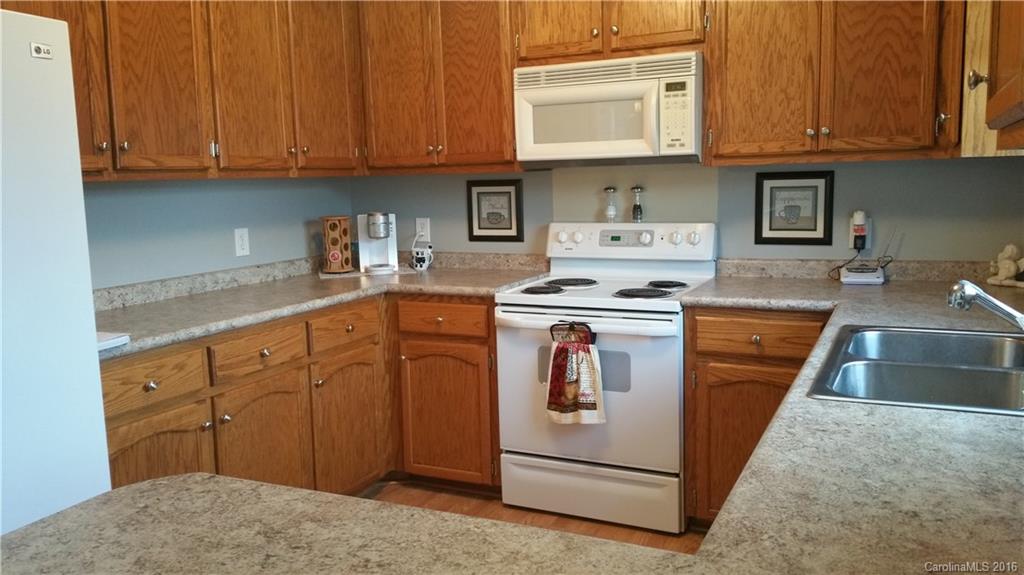 1348 Lawrence Road Clover, SC 29710 - Photo 3 of 21 a kitchen with stainless steel appliances granite countertop a stove and a cabinets