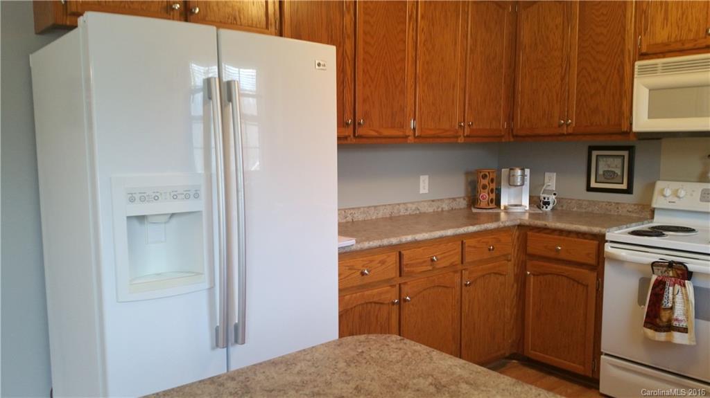 1348 Lawrence Road Clover, SC 29710 - Photo 5 of 21 a kitchen with stainless steel appliances granite countertop a refrigerator and a sink