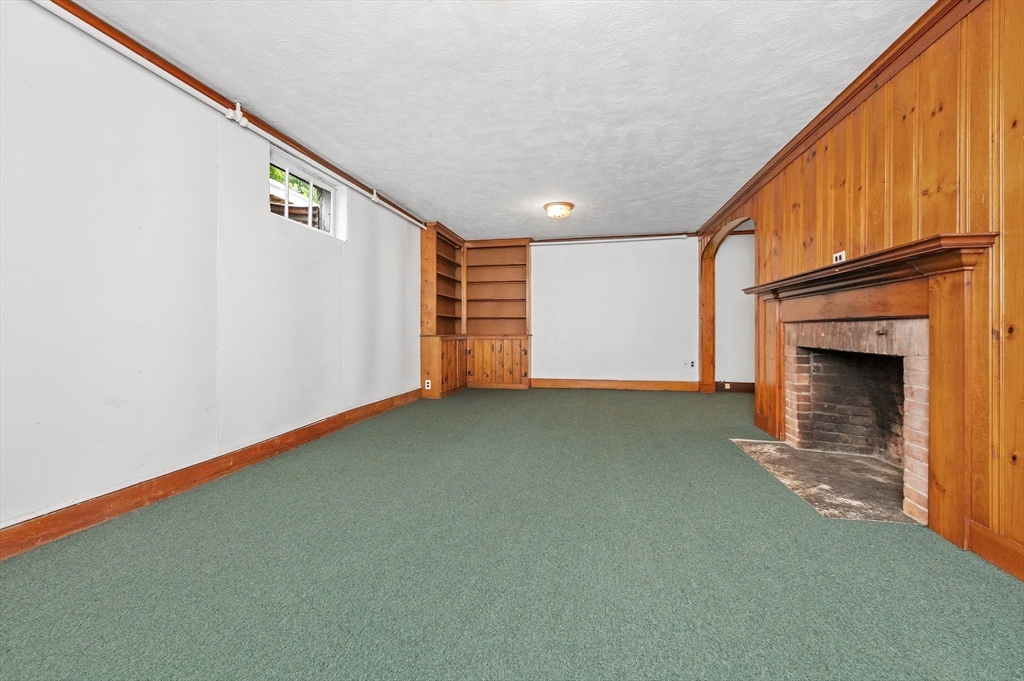 68 Gloucester Road Westwood, MA 02090 - Photo 23 of 30 a view of an empty room with a fireplace