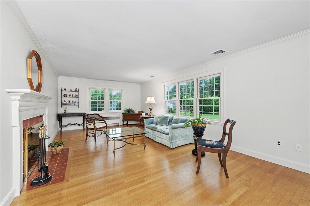 68 Gloucester Road Westwood, MA 02090 - Photo 5 of 30 a living room with furniture and a fireplace