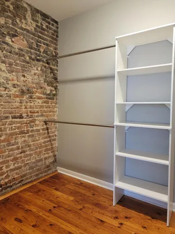 a view of an empty walk in closet