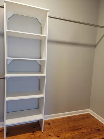 a view of an empty walk in closet
