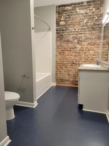 a very nice looking room with a bathroom