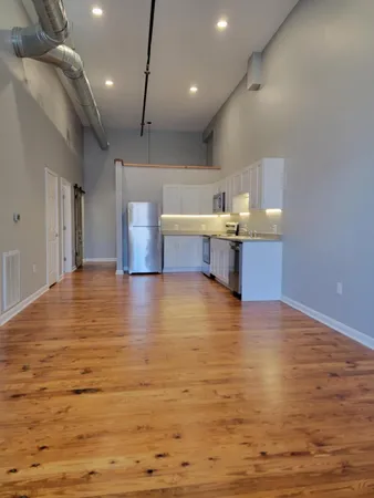 a view of kitchen and kitchen with a sink