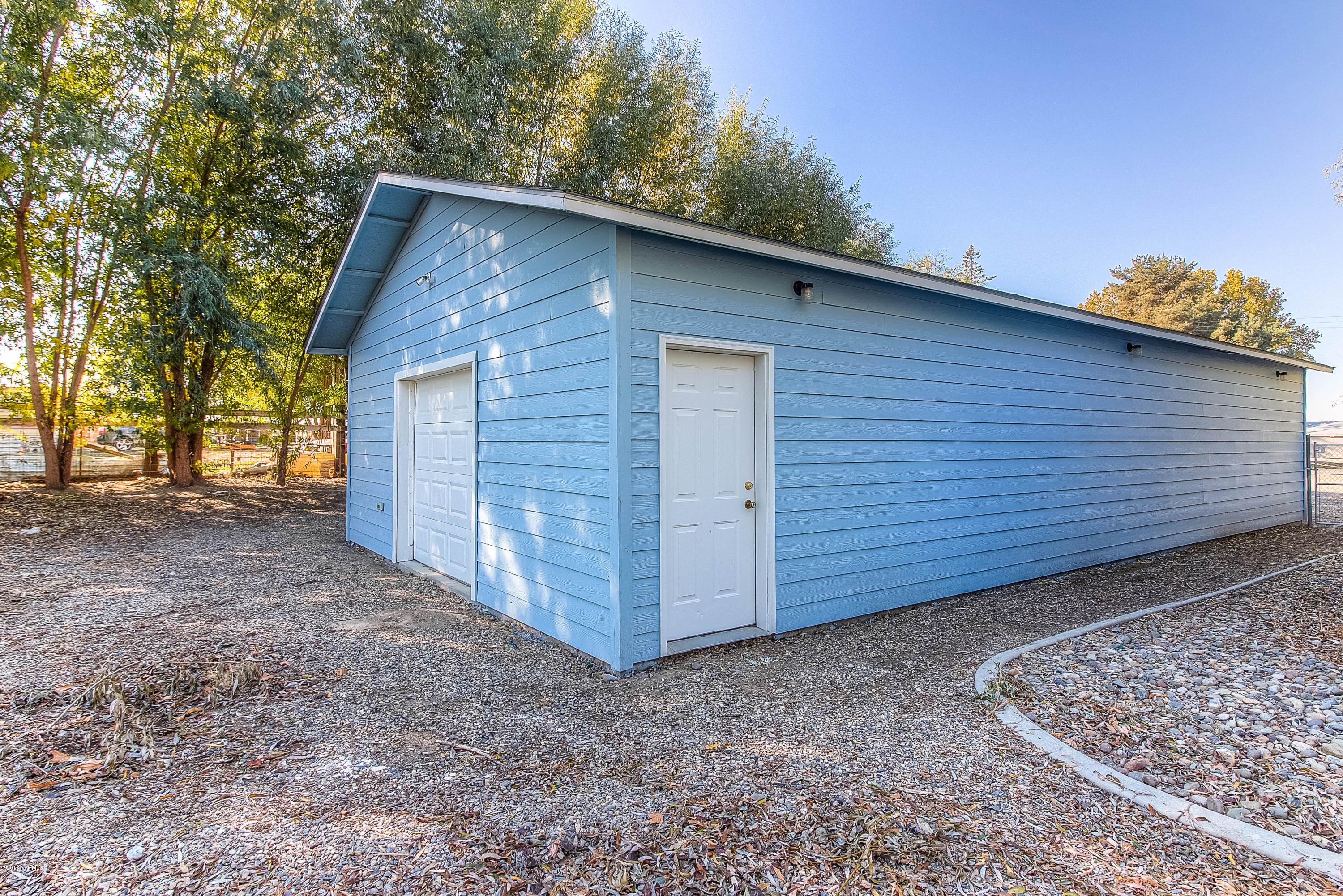 351 Liberty Road Granger, WA 98932 - Photo 22 of 28 a view of a house with a backyard