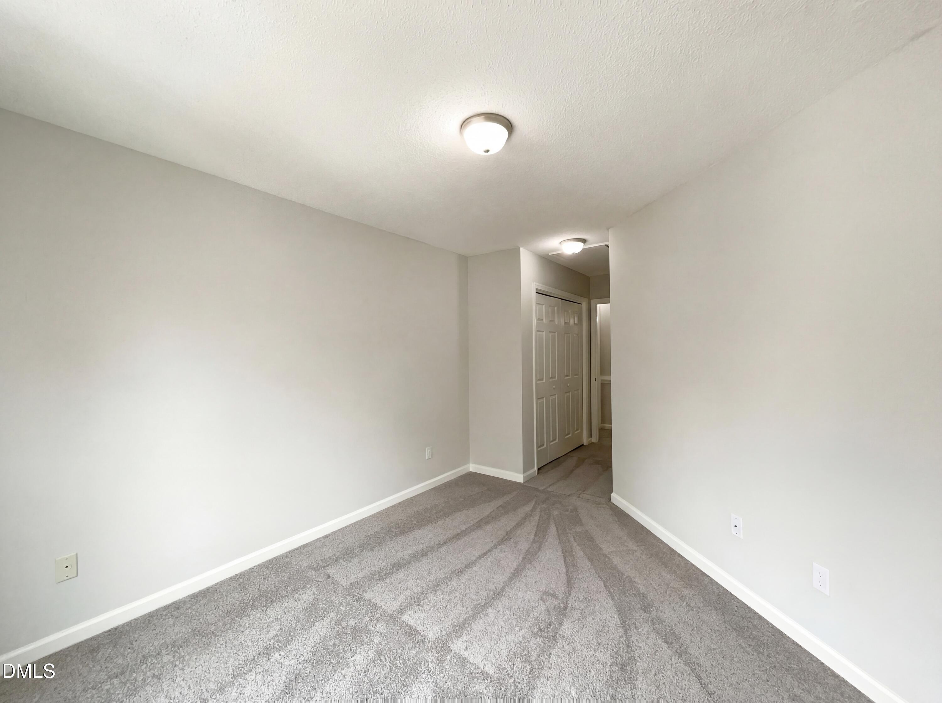 12213 Freemont Lane Raleigh, NC 27613 - Photo 13 of 19 a view of an empty room