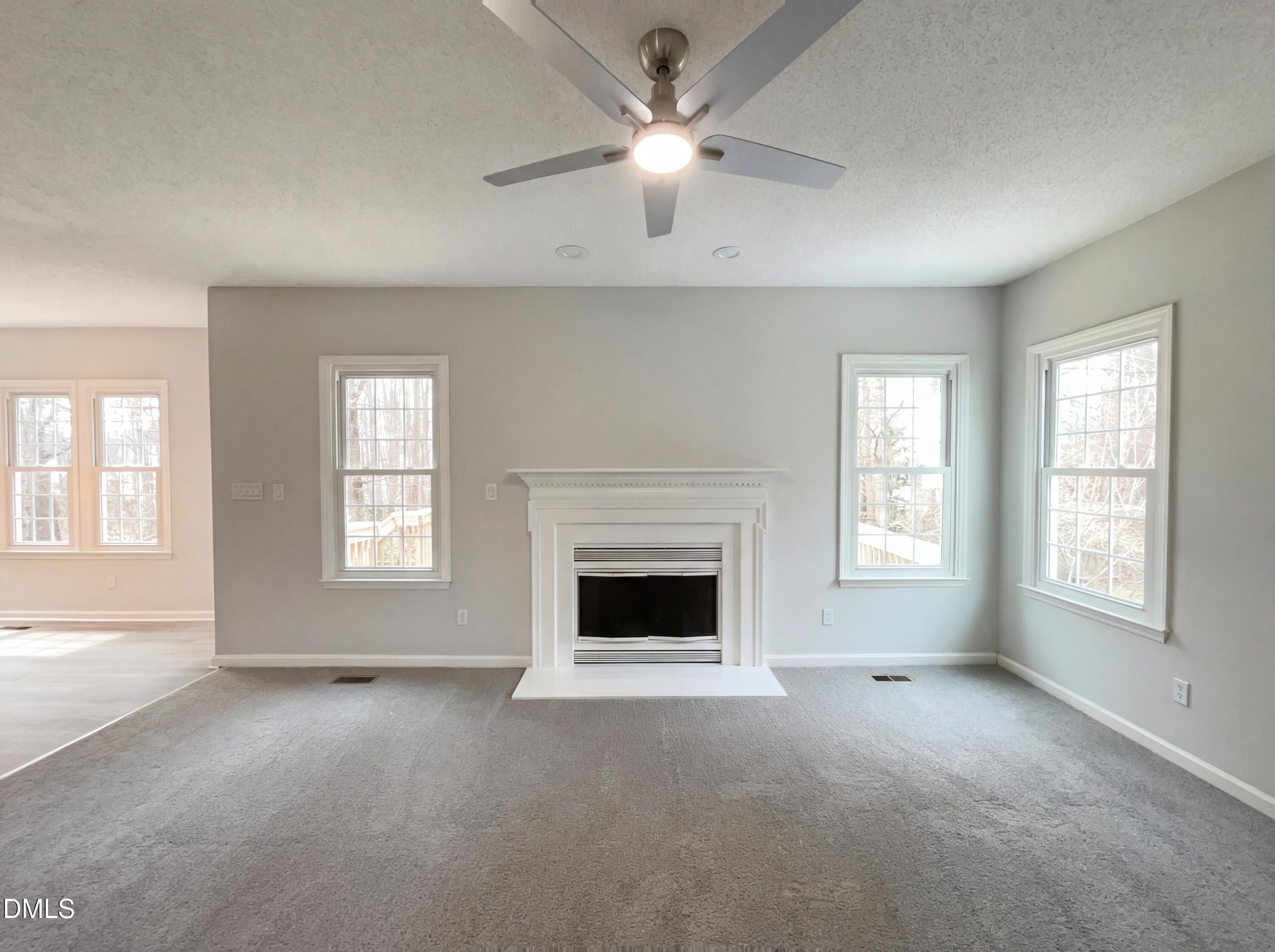12213 Freemont Lane Raleigh, NC 27613 - Photo 3 of 19 a living room with furniture and a fireplace