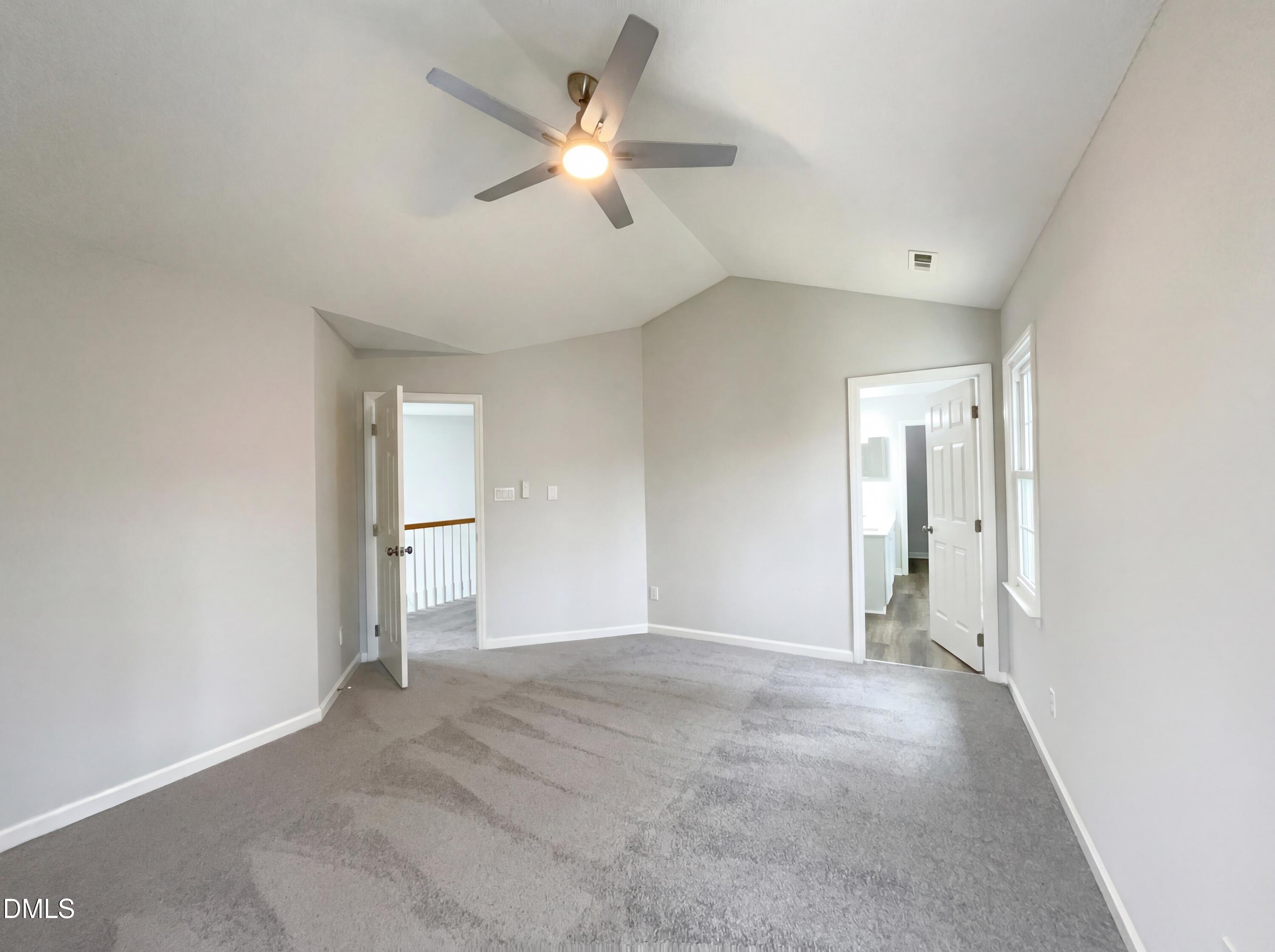 12213 Freemont Lane Raleigh, NC 27613 - Photo 4 of 19 an empty room with a ceiling fan and a window
