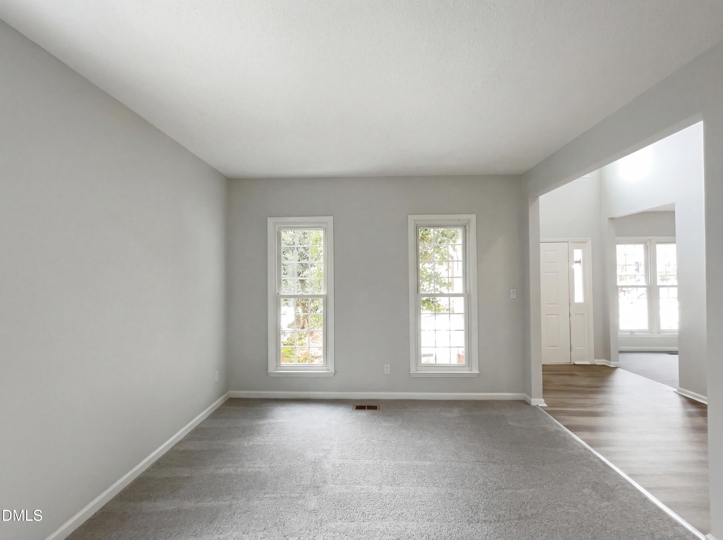 12213 Freemont Lane Raleigh, NC 27613 - Photo 7 of 19 an empty room with windows