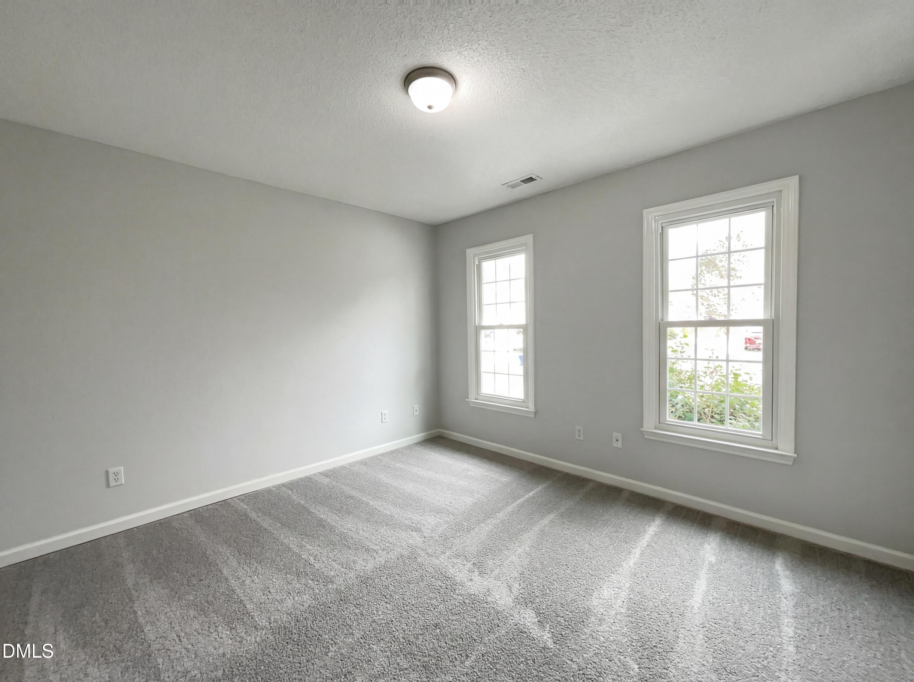 12213 Freemont Lane Raleigh, NC 27613 - Photo 10 of 19 an empty room with a window